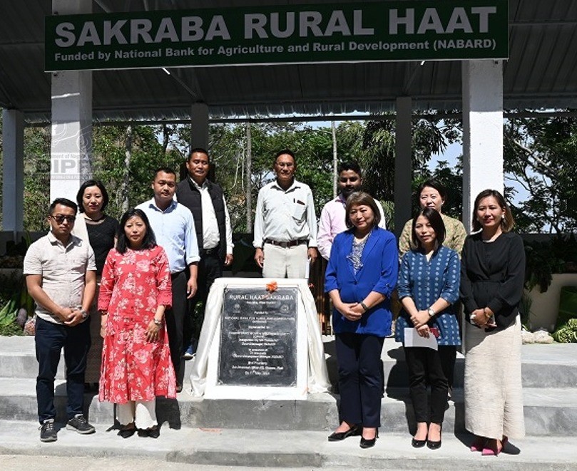 Officials pose for lens during the inauguration of Rural Haat in Sakraba on May 11. (DIPR Photo)
